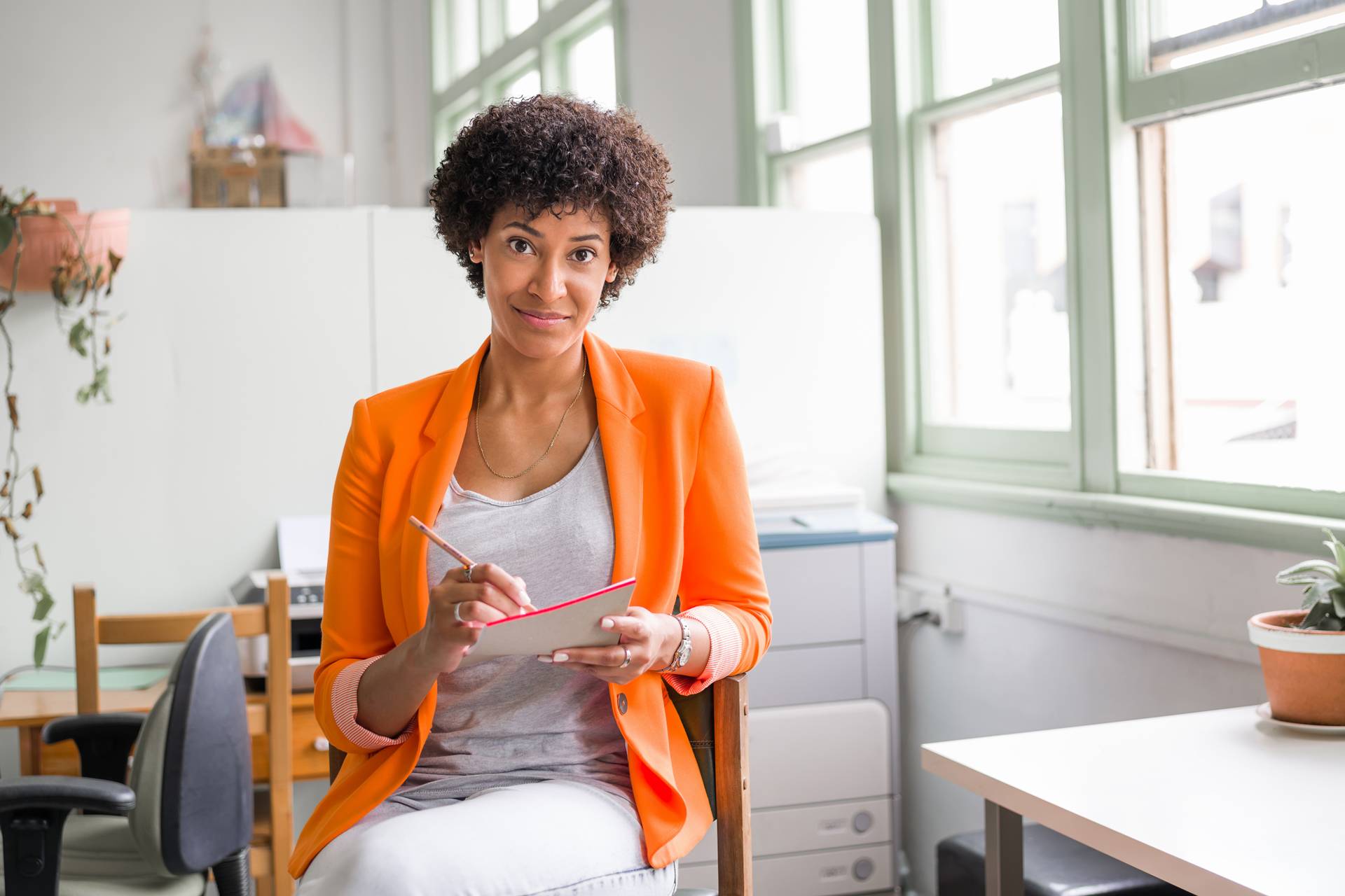 Young woman working at a computer in an office